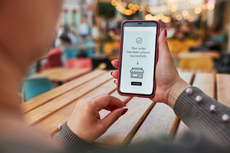 Online shopping. Buying product in online shop. Person paying using mobile payment app. Customer ordering item in e-shop on smartphone. E-commerce over internet. Sending money online